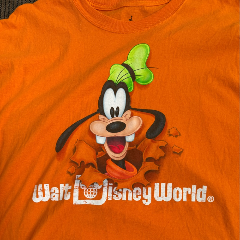 Orange goofy T shirt.
